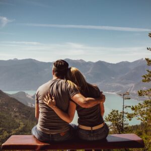couple sitting overlooking mountain