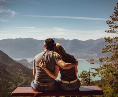 couple sitting overlooking mountain